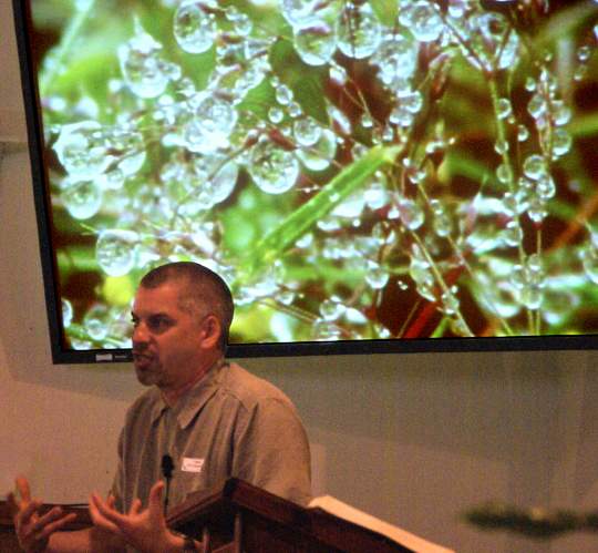 Pastor Phil Stevenson using a water drops illustration
 while preaching "Stephen and His Crime" - 6/1/08