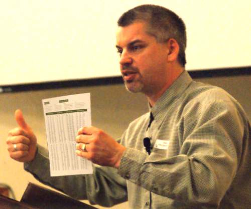 Pastor Phil showing Bible reading plan - 1/4/09